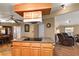 Kitchen island with cooktop and wood cabinets at 34205 Island Dr, Leesburg, FL 34788