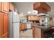 Bright kitchen, featuring wood cabinets and an island at 34205 Island Dr, Leesburg, FL 34788
