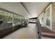 Covered porch with view of lush greenery at 34205 Island Dr, Leesburg, FL 34788