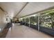 Covered porch with ample space for relaxing at 34205 Island Dr, Leesburg, FL 34788