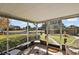 Relaxing screened porch overlooking the canal and backyard at 34205 Island Dr, Leesburg, FL 34788
