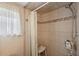 Clean shower stall with tiled walls and handheld shower head at 34205 Island Dr, Leesburg, FL 34788