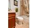 Bathroom with tiled shower/tub combo, decorative shower curtain, and stylish vanity at 3554 Oracle Ct, The Villages, FL 32163