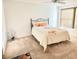 Cozy main bedroom with ceiling fan, large window and neutral colored carpet at 3554 Oracle Ct, The Villages, FL 32163
