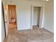 Bedroom with double door closet and access to hallway at 3554 Oracle Ct, The Villages, FL 32163