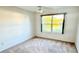 Bright bedroom with fan, natural light and neutral carpet at 3554 Oracle Ct, The Villages, FL 32163