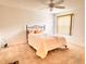 Bright bedroom with a ceiling fan and a large window at 3554 Oracle Ct, The Villages, FL 32163