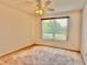 Bedroom featuring carpeted floors, a ceiling fan, and a sunlit window at 3554 Oracle Ct, The Villages, FL 32163