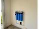 Garage with water filter, painted walls, and concrete floors at 3554 Oracle Ct, The Villages, FL 32163