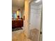 Main bathroom with a walk-in closet, vanity, and door at 3554 Oracle Ct, The Villages, FL 32163