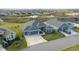 Aerial view of a house and surrounding neighborhood, showcasing curb appeal and community at 4442 Shannon Loop, The Villages, FL 32163