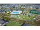 Community pool, tennis courts, shuffleboard and bocce at 4442 Shannon Loop, The Villages, FL 32163