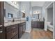 Bathroom featuring granite countertops, dual sinks, modern fixtures, and ample storage space at 4442 Shannon Loop, The Villages, FL 32163