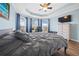 Bright bedroom with wood-look floors, and ceiling fan at 4442 Shannon Loop, The Villages, FL 32163