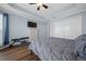 Bedroom with wood-look floors, and ample closet space at 4442 Shannon Loop, The Villages, FL 32163