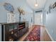 Bright and spacious entryway with wood-look flooring and decorative rug at 4442 Shannon Loop, The Villages, FL 32163