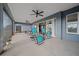 Covered patio with ceiling fans and comfortable seating, perfect for outdoor enjoyment at 4442 Shannon Loop, The Villages, FL 32163