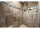 Stylish tiled shower with a built-in niche, grab bar, and a modern shower head, offering convenience at 4442 Shannon Loop, The Villages, FL 32163