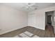 Neutral bedroom featuring wood-look floors, a ceiling fan, and closet at 507 Delfin Rd, The Villages, FL 32163