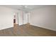 Bedroom with hardwood floors and bathroom access at 507 Delfin Rd, The Villages, FL 32163