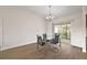 Dining area featuring hardwood floors and sliding doors to an outdoor patio at 507 Delfin Rd, The Villages, FL 32163