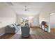 Bright living space with large window, plush seating, and light hardwood floors at 507 Delfin Rd, The Villages, FL 32163