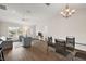 Bright and open living area featuring hardwood floors flowing into the dining area at 507 Delfin Rd, The Villages, FL 32163