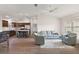 Spacious living room flowing into the kitchen and featuring hardwood floors at 507 Delfin Rd, The Villages, FL 32163