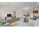 Comfortable living space with hardwood floors flows into dining area and kitchen at 507 Delfin Rd, The Villages, FL 32163
