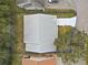 Top-down view of a house with gray roof and surrounding landscape at 5505 Tangelo St, Leesburg, FL 34748