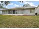 House with sunroom and large backyard at 5505 Tangelo St, Leesburg, FL 34748