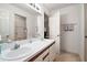 Double vanity bathroom with updated fixtures at 5505 Tangelo St, Leesburg, FL 34748