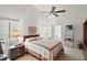 Cozy bedroom with double bed, nightstands, and ceiling fan at 5505 Tangelo St, Leesburg, FL 34748