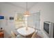 Cozy corner dining area with a round table and four chairs at 5505 Tangelo St, Leesburg, FL 34748