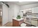 Efficient kitchen with white cabinets and kitchen island at 5505 Tangelo St, Leesburg, FL 34748