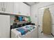 Laundry room with washer, dryer and cabinets at 5505 Tangelo St, Leesburg, FL 34748
