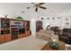 Bright living room featuring built-in shelving and comfortable seating at 5505 Tangelo St, Leesburg, FL 34748