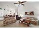 Spacious living room with floral couches and access to dining area at 5505 Tangelo St, Leesburg, FL 34748