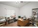 Home office with desk, shelving and window at 5505 Tangelo St, Leesburg, FL 34748