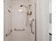 Accessible shower with grab bars and tiled walls at 5505 Tangelo St, Leesburg, FL 34748