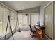 Bright sunroom with desk, chair and window at 5505 Tangelo St, Leesburg, FL 34748