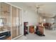 Sunroom with sliding glass doors and fans at 5505 Tangelo St, Leesburg, FL 34748