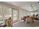 Sunroom with view, vertical blinds, and seating at 5505 Tangelo St, Leesburg, FL 34748