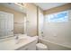 Bright bathroom featuring a shower/tub combo and updated vanity at 5616 Illumination Ln, Leesburg, FL 34748