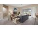 Living room with sliding glass doors leading to the backyard at 5616 Illumination Ln, Leesburg, FL 34748