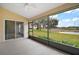 Spacious screened porch overlooking a tranquil pond at 5616 Illumination Ln, Leesburg, FL 34748