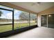 Relaxing screened porch with pond views at 5616 Illumination Ln, Leesburg, FL 34748