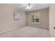 Carpeted bedroom with window and ceiling fan at 571 Smithfield Pl, The Villages, FL 32162