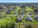 Aerial view showcasing home's location in a golf community at 572 Dowling Cir, Lady Lake, FL 32159