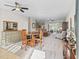 Dining room with round table and four chairs, connecting to living room at 572 Dowling Cir, Lady Lake, FL 32159